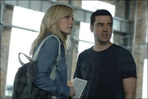 Laura Harris and Ron Livingston in Defying Gravity (2009)