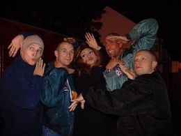 Screenwriter Vekeana Dhillon doing the vogue with the cast of I - Proud to Be an Indian (2004).