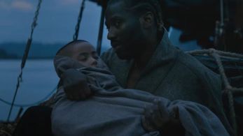 Still of Madeleine Yuna Voyles and John David Washington - The Creator 2023