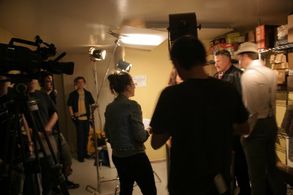 Bryn Woznicki directs Chris Ferro on the set of 