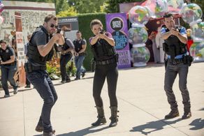 Sophia Bush, Jon Seda, and Patrick John Flueger in Chicago P.D. (2014)