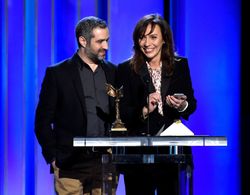 Stella Savino, Bradley J. Fischer. Stella Savino, right, accepts the award for best cinematography for 