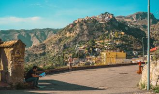Alexander Jeffery reviews the script at the Castello Saraceno overlook in Taormina.