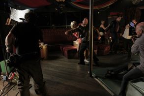 Ajarae Coleman (blonde wig) on set of S.M.A.C.K. Unit.