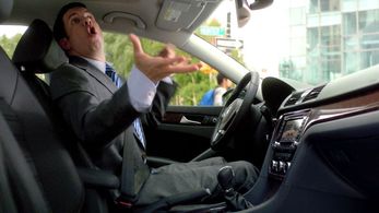 Michael Faulkner air-drumming in a VW