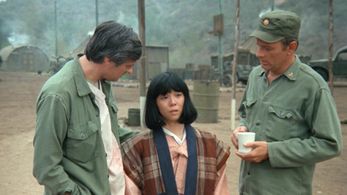 Alan Alda, Larry Linville, and Saachiko in M*A*S*H (1972)