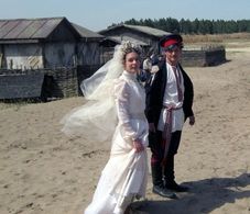 Evgeniy Tkachuk and Darya Ursulyak in And Quiet Flows the Don (2015)