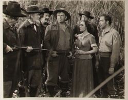 Wallace Beery, Dolores del Rio, and John Howard in The Man from Dakota (1940)