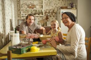 Jennifer (Orla Hill) cooking with Marion (Vanessa Redgrave) and James (Christopher Eccleston)