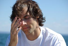 Peter McGennis writing Queen City on the banks of Lake Erie.