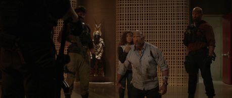 Dwayne Johnson, Jason William Day, and McKenna Roberts in Skyscraper (2018)