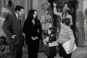 John Astin, Carolyn Jones, Lisa Loring, and Ken Weatherwax in The Addams Family (1964)