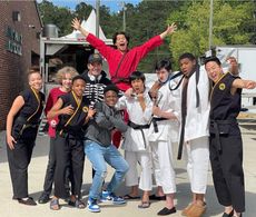 Behind the scenes still of Brock Duncan and cast of Cobra kai