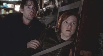 Emily Bergl and Adam Kaufman in Taken (2002)