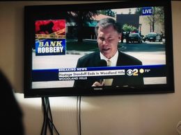 Reporter Kent Shocknek on hostage wife's tv screen, on CBS-TV's NCIS: Los Angeles.