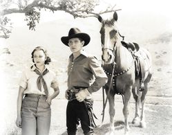 Marie Burton and Bob Steele in Sundown Saunders (1935)