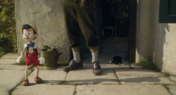 Tom Hanks and Benjamin Evan Ainsworth in Pinocchio (2022)