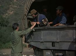 Alan Alda, Patrick Adiarte, and Virginia Ann Lee in M*A*S*H (1972)