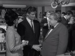 Roger Moore, John Baskcomb, and Rosemarie Reede in The Saint (1962)