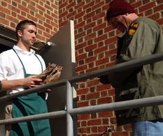 Cast members Tyler Hunt and Joel Nathan King prepare for a take.