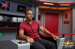 Mark Lund on the bridge of the USS Enterprise at the Star Trek Original Series Set Tour.