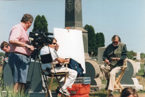 Mark Cerulli interviewing director George Romero for HBO - in the graveyard from his classic Night of the Living Dead.