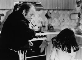 Erika Katz and Burt Young in Amityville II: The Possession (1982)