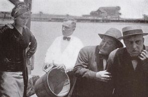 John E. Brennan, Dick Coburn, Harry DeRoy, and Ruth Roland in The Captivating Widow (1913)
