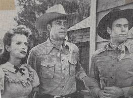 Carole Mathews, Tex Harding, and Charles Starrett in Outlaws of the Rockies (1945)