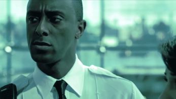 as the airport security guard, in a scene from the film, Departures