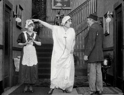 Marta Golden, Charles Inslee, and Edna Purviance in Work (1915)