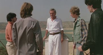 Terence Stamp, Will More, José Luis Fernández 'Pirri', Enrique San Francisco, and Camilo Vilanova in The Hit (1984)
