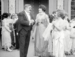 Eric Campbell, Charlotte Mineau, and Edna Purviance in The Rink (1916)