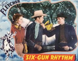 Joan Barclay, Tex Fletcher, and Reed Howes in Six-Gun Rhythm (1939)