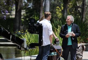Director Bryan Fox, who also plays Alex, chatting with Henry Winkler as David.