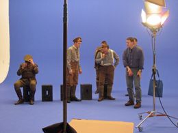 Robert Child directs actors on blue screen stage in Toronto Canada for 11/11.