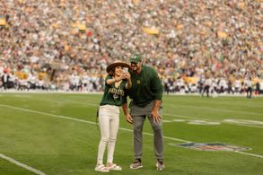 Franki and Baktiarri on the field after her anthem
