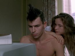 Julie Delpy and Cyrille Autin in Detective (1985)