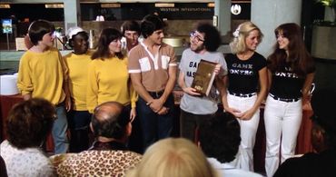 Michael J. Fox, Kirsten Baker, Debra Clinger, David Damas, Joel Kenney, David Naughton, Deborah Richter, and Alan Solomo