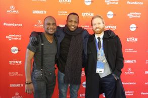 Still of Qasim Basir, Steven Holleran , and Ramfis Myrthil at premier for 