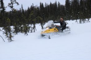 On location riding a Snow machine for Ablation after a snow storm in Alaska