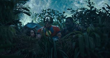 Idris Elba, John Cena, and Daniela Melchior in The Suicide Squad (2021)