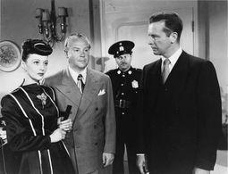 Steven Geray, Dick Powell, and Nina Vale in Cornered (1945)