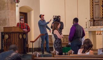 Jason Michael Brescia directing the cast of 