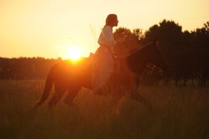 Jency riding in Madeline's oil. Production still