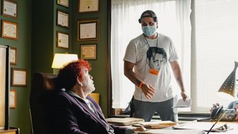 Adam Sigal and John Malkovich on the set of 