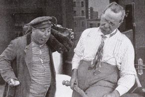 John E. Brennan and Harry DeRoy in Wanted: A Plumber (1913)