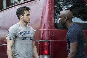 David Gyasi and Chris Wood in Containment (2016)