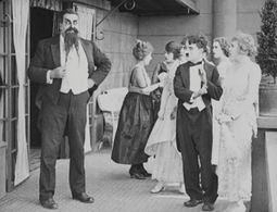 Charles Chaplin, Eric Campbell, Marta Golden, and Edna Purviance in The Adventurer (1917)