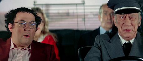 Louis de Funès, Raymond Bussières, Coluche, and Ann Zacharias in The Wing or The Thigh? (1976)